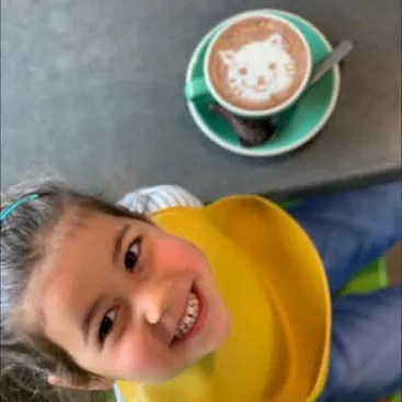 Child with cat latte art